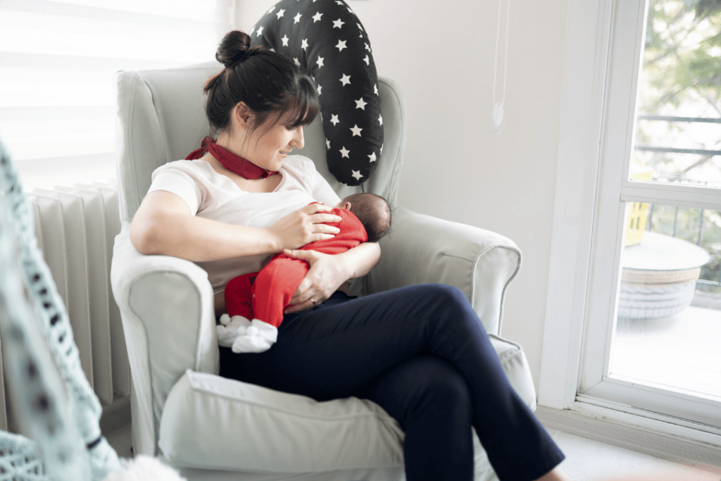 Mother breastfeeding comfortably at home